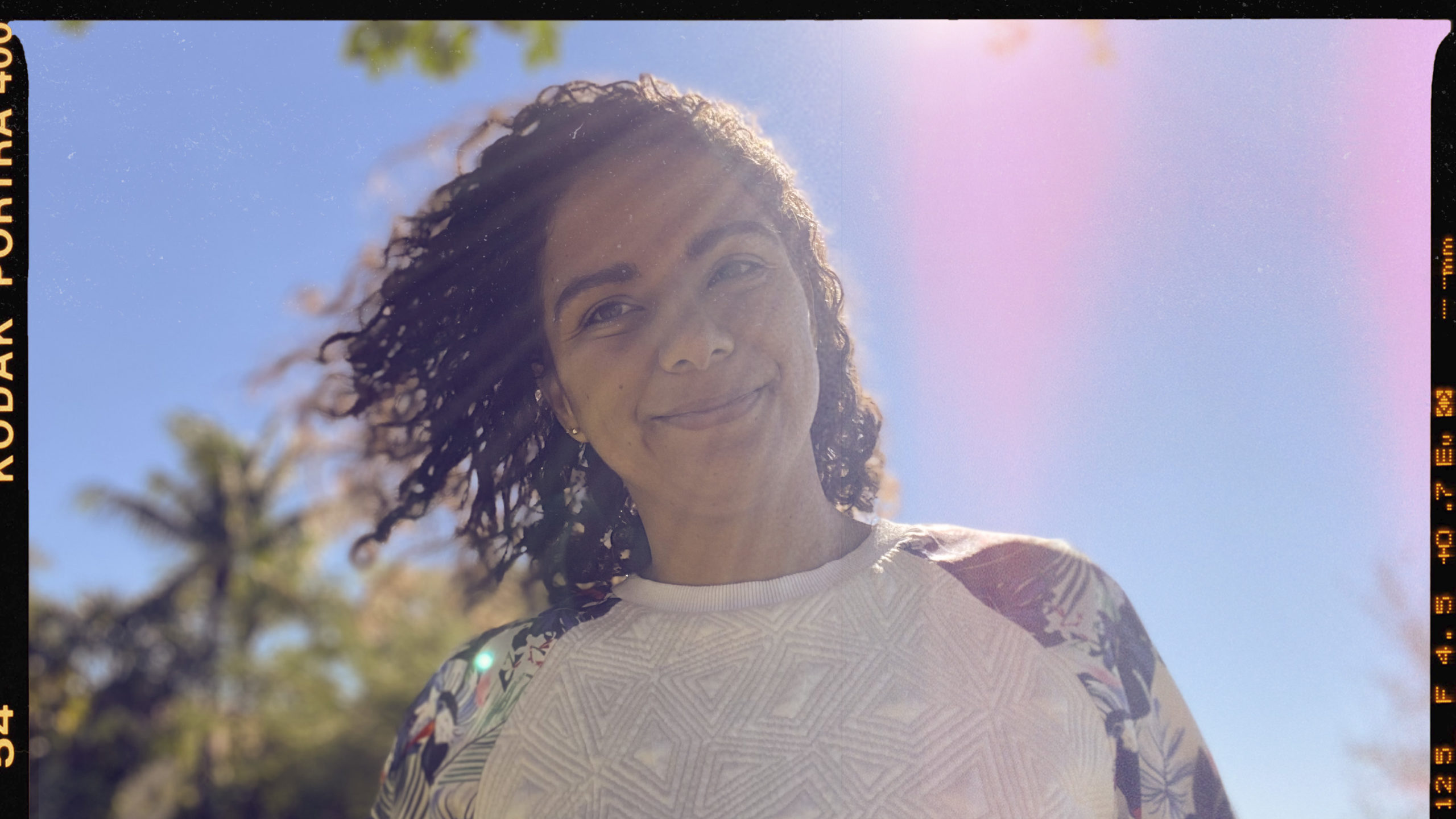 Sun shining on Erika's face as she is smiling at the camera